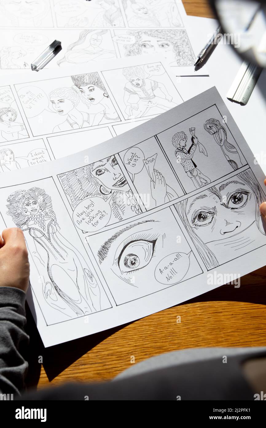 The artist draws frames of comic book characters. An animator designer creates a storyboard. Stock Photo
