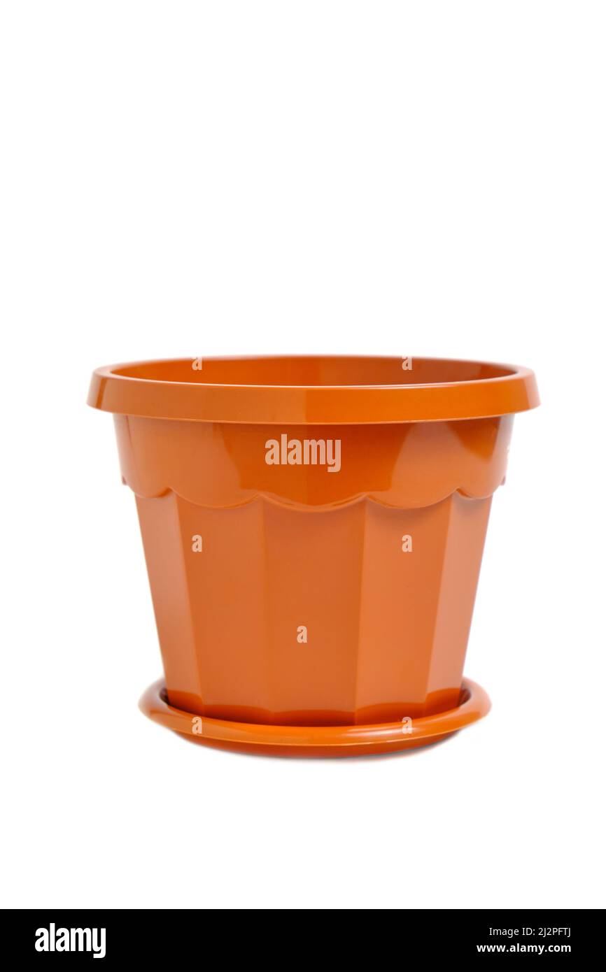 Brown, plastic, empty flower pot on a white background Stock Photo