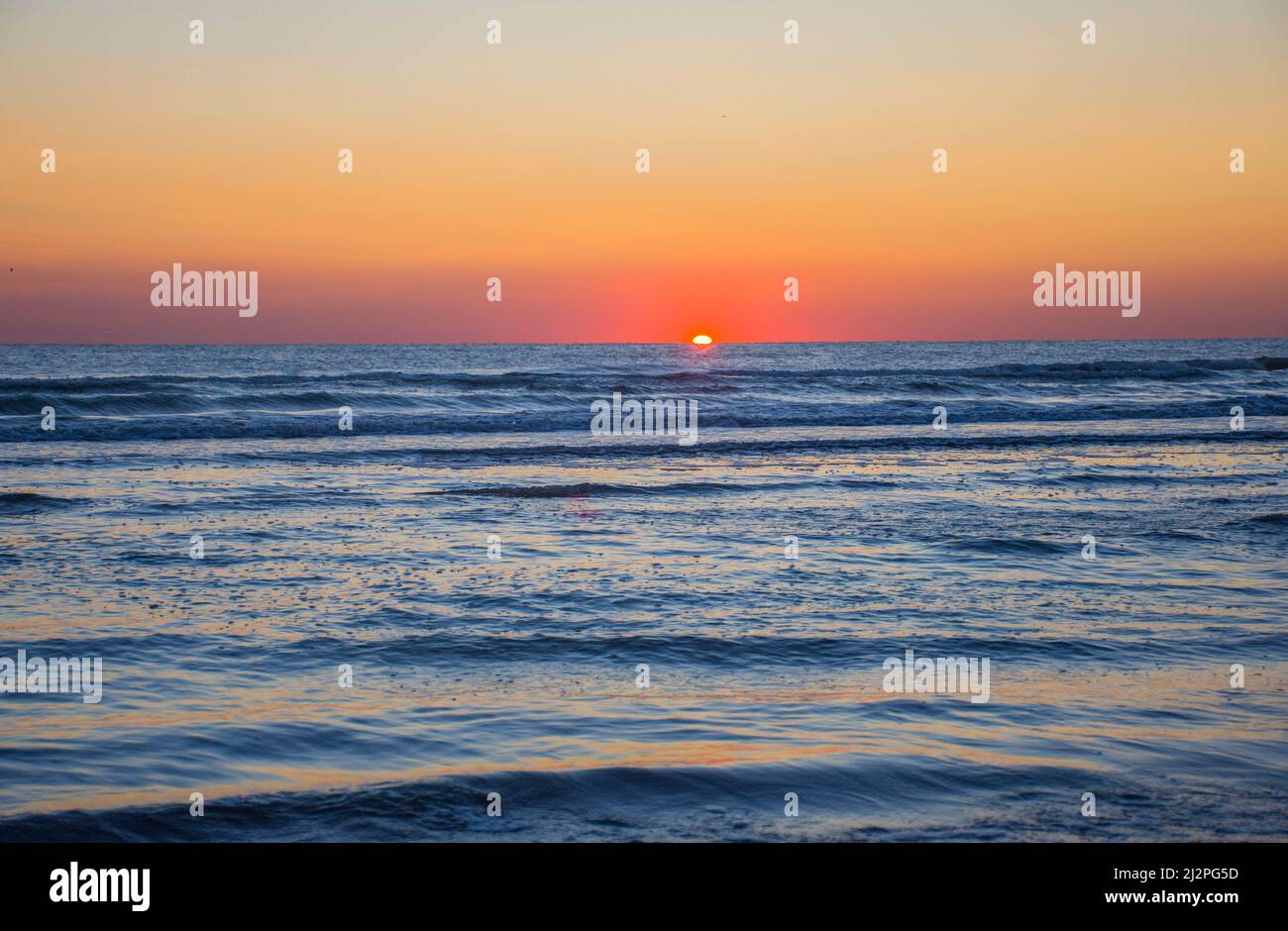 the seascape of the beginning of a new day, the sunrise in the sea Stock Photo