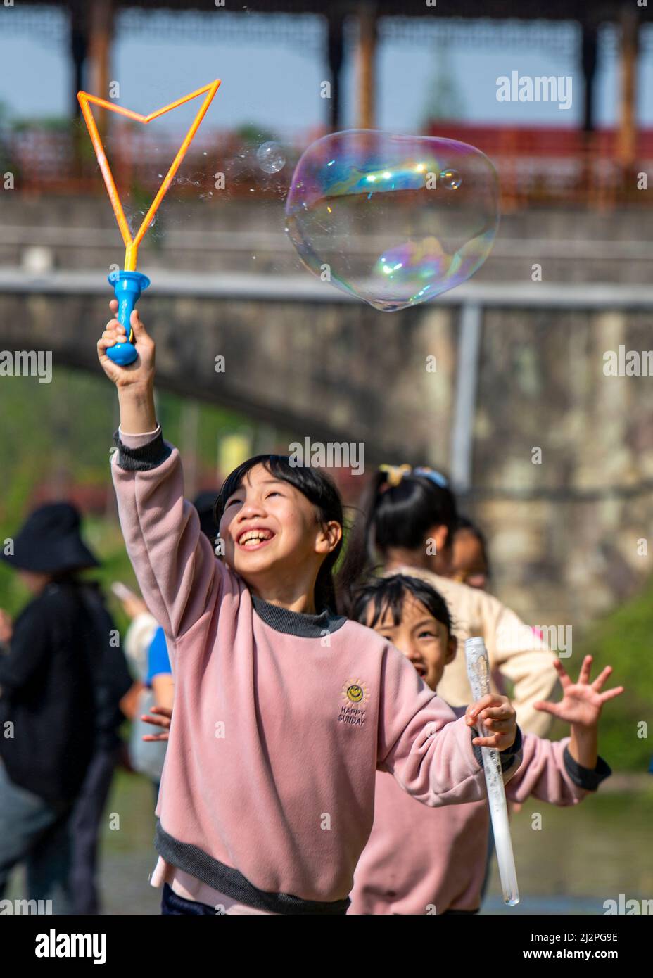 Jinhua, China's Zhejiang Province. 3rd Apr, 2022. Children play along a stream in Langya Town of Wucheng District, Jinhua, east China's Zhejiang Province, April 3, 2022. Credit: Hu Xiaofei/Xinhua/Alamy Live News Stock Photo
