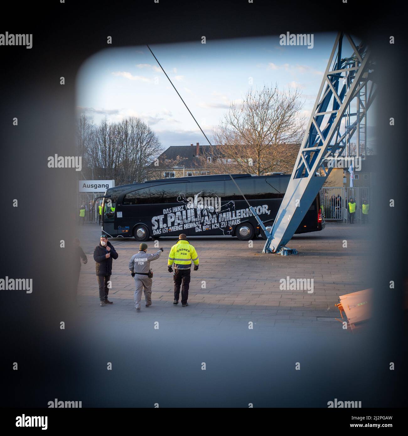 Security officers guard the arrival of FC St. Pauli at the