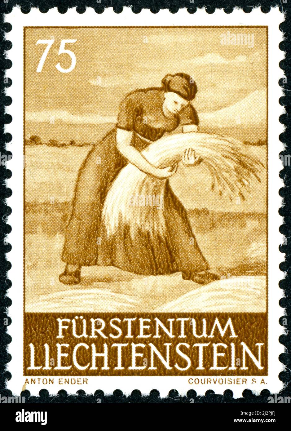 LIECHTENSTEIN - CIRCA 1960: A postal stamp printed in Liechtenstein, showing woman of sheaflayer, circa 1960 Stock Photo