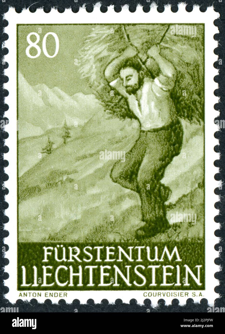 LIECHTENSTEIN - CIRCA 1961: A postal stamp printed in Liechtenstein, shown Man Carrying Hay, circa 1961 Stock Photo