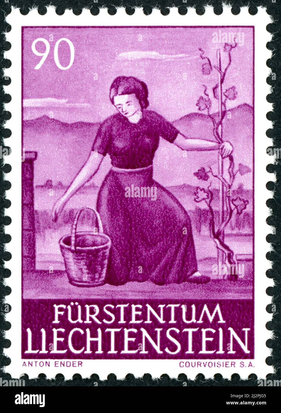 LIECHTENSTEIN - CIRCA 1961: A postal stamp printed in Liechtenstein, showing woman in vineyard, circa 1961 Stock Photo