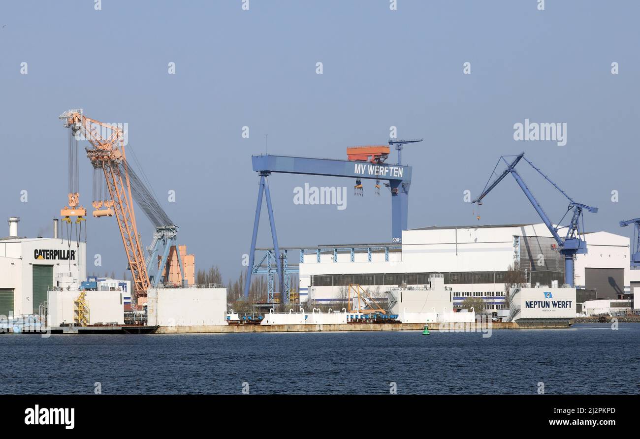 Rostock, Germany. 25th Mar, 2022. The facilities of Caterpillar (lr), MV shipyards and Neptun
