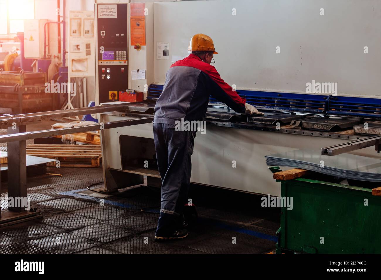Operator working with CNC hydraulic press brake Stock Photo Alamy