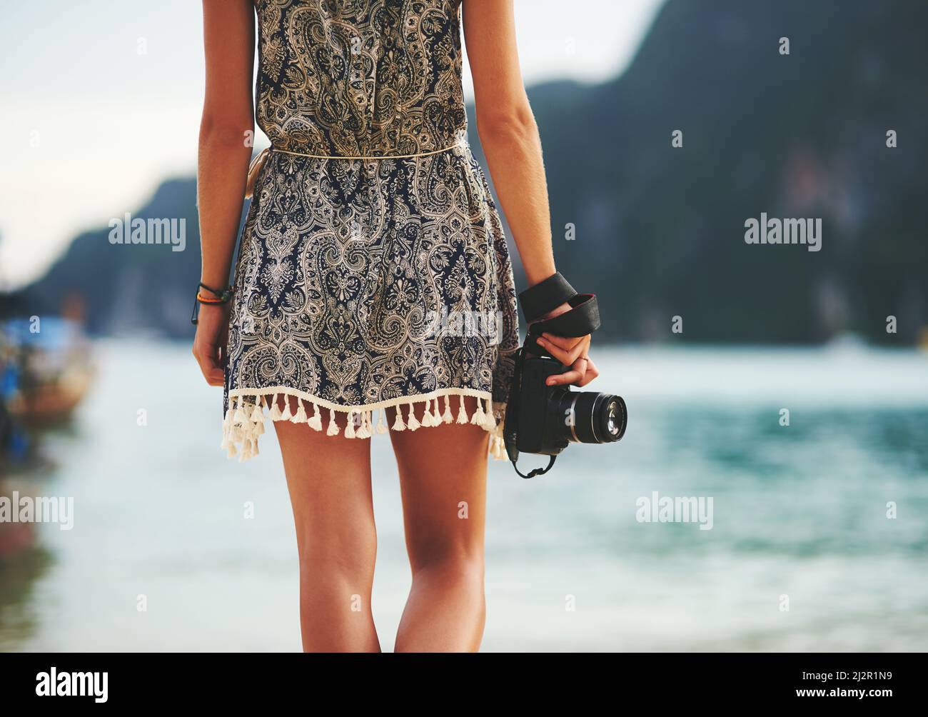 Rear view of a woman walking on the beach hi-res stock photography and ...