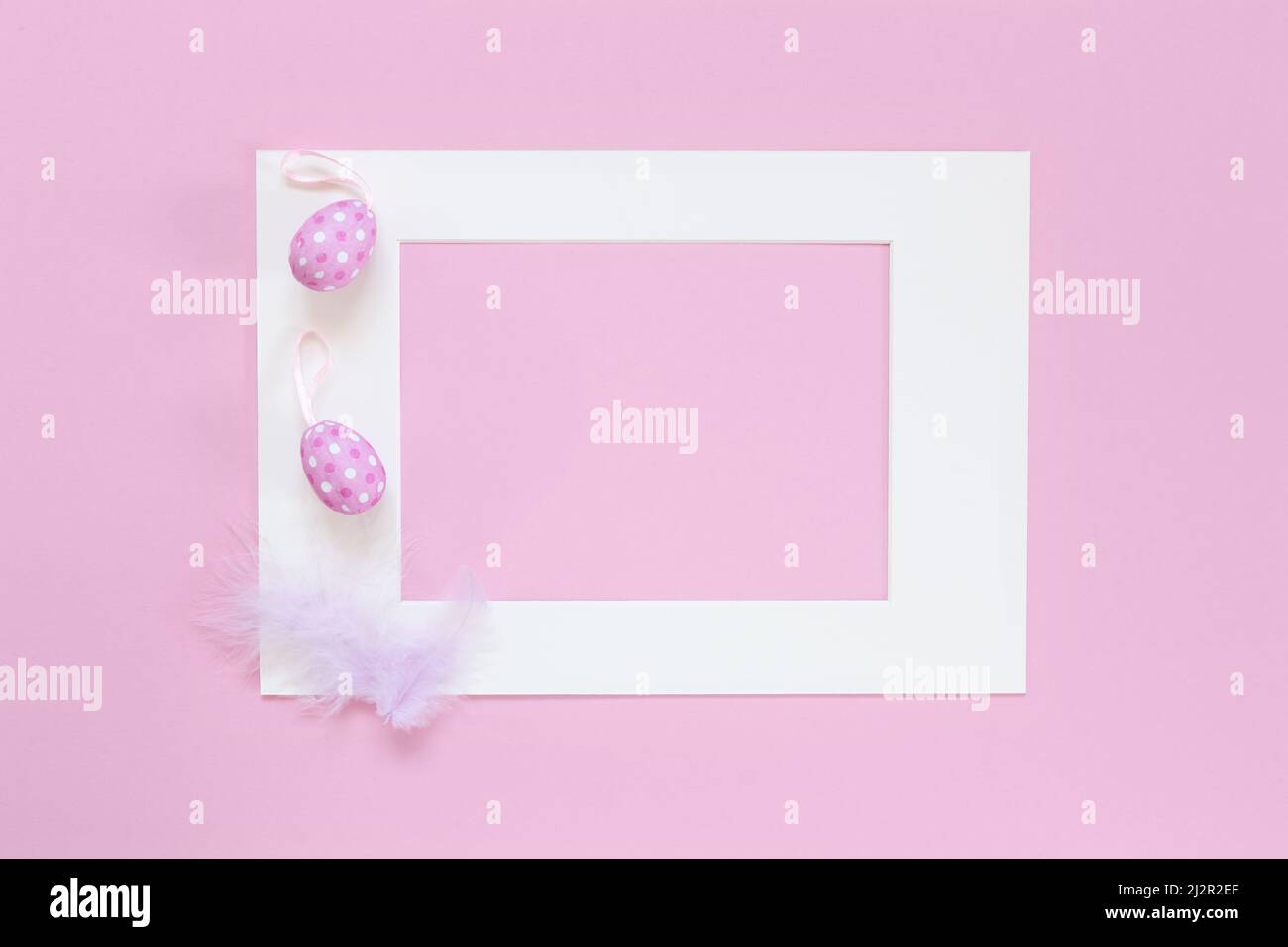 Template with Easter eggs and frame on the pink background Stock Photo ...