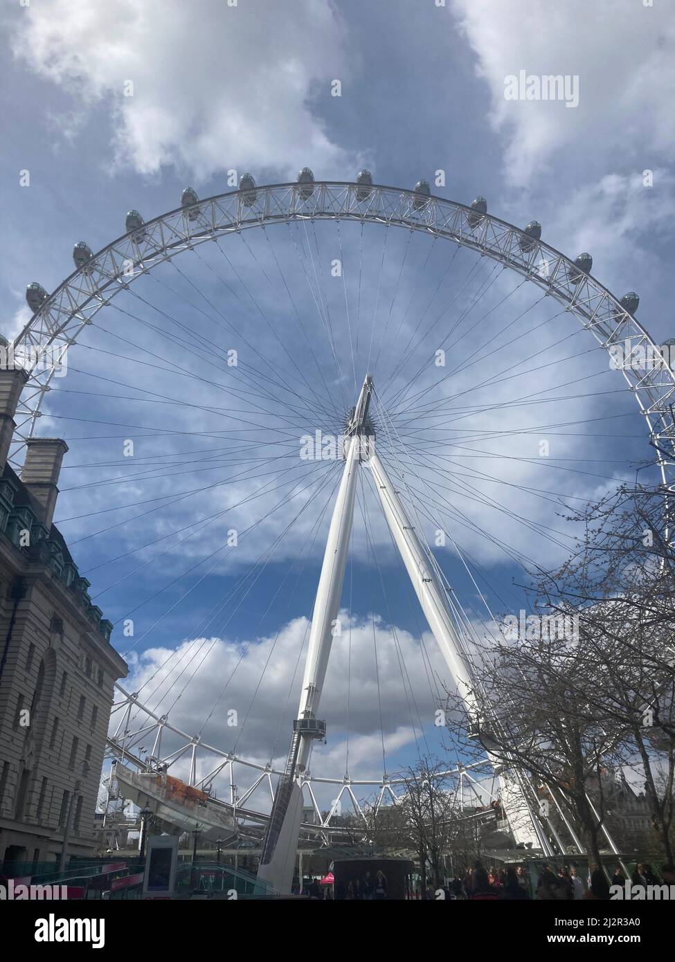 The London Eye, or Millennium Wheel, big wheel attraction on a sunny day in Waterloo, London Stock Photo