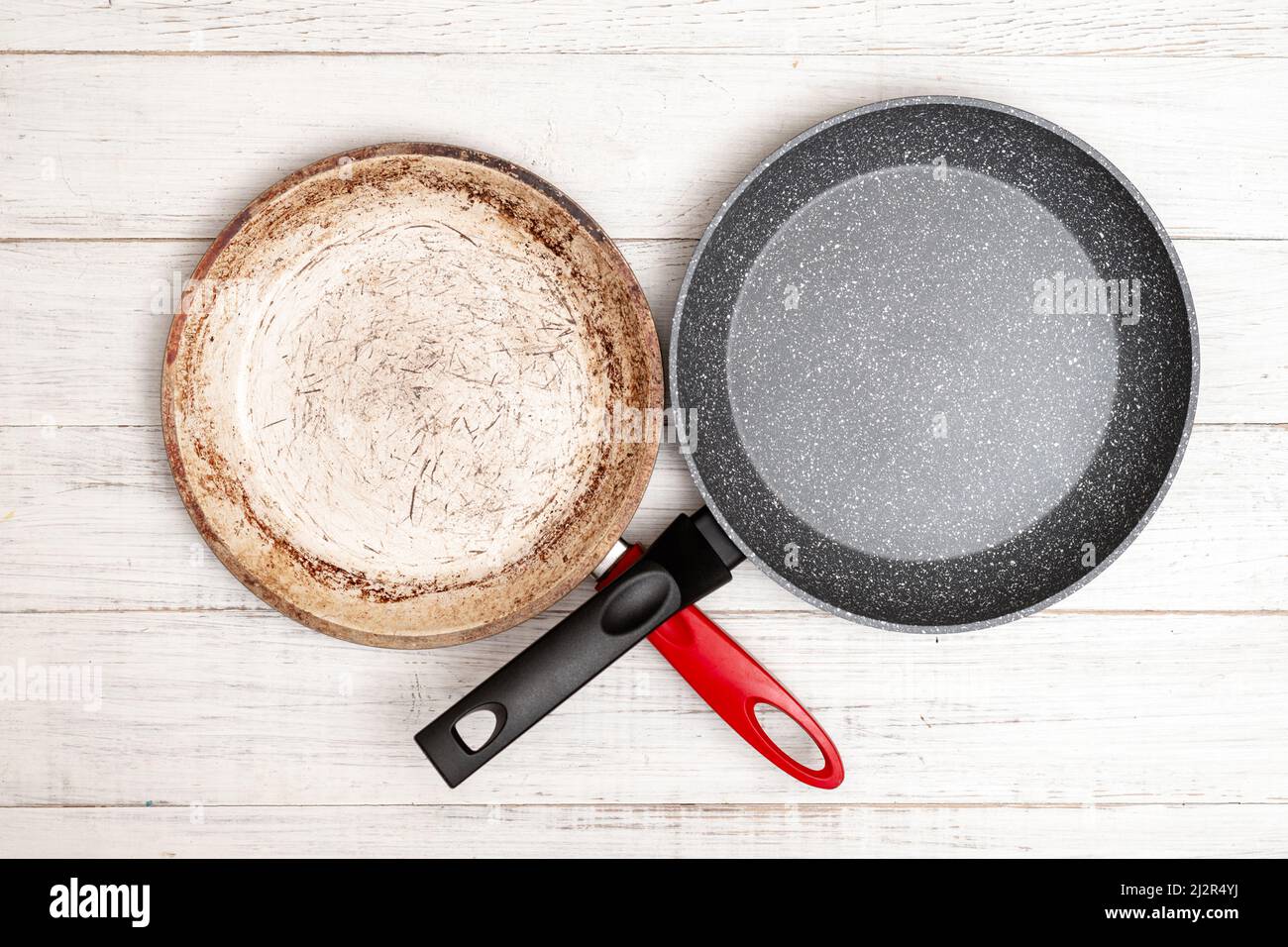 Comparison of pans. Old and new frying pan. New and old damaged non