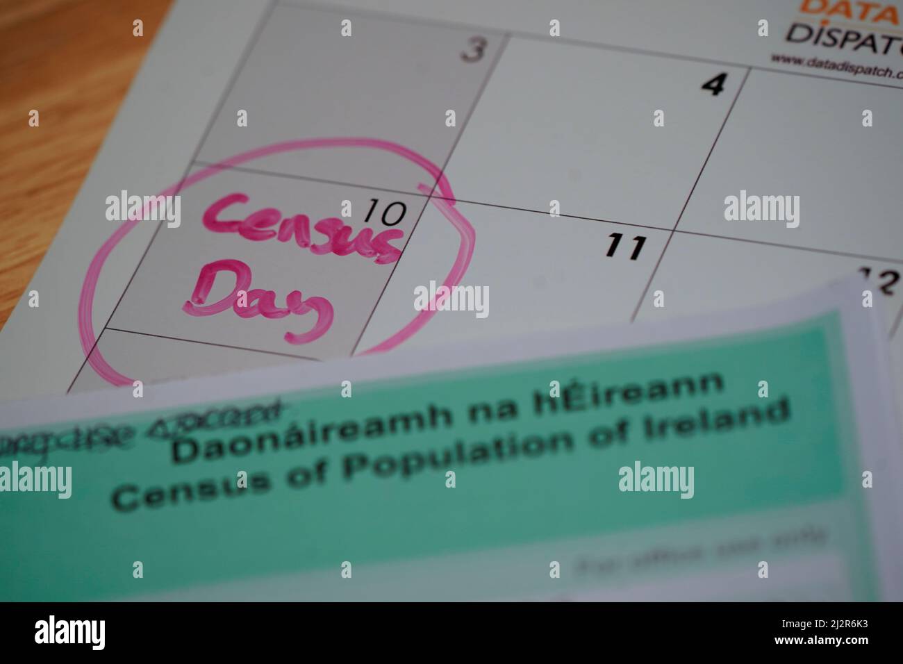 A copy of the forms for the irish census 2022 sits on top of a calendar