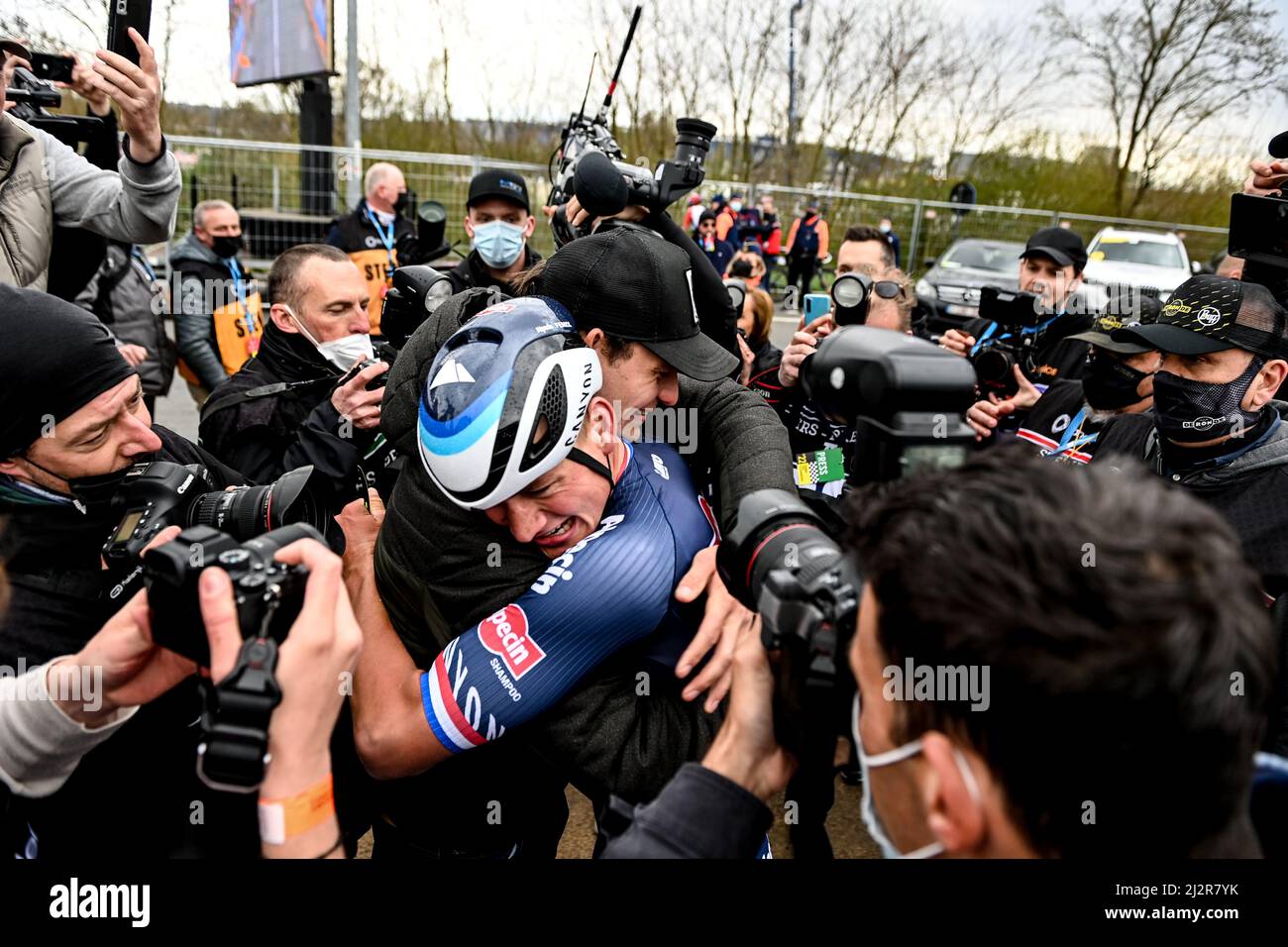 Belgium. 3rd April 2022, Belgium. The 2022 Tour of Flanders from Antwerp (Antwerpen) to Oudenaarde. Mathieu Van Der Poel for team AlpecinFenix (NED) embraces his team mate on the finish line after winning the stage. Credit: Peter Goding/Alamy Live News Stock Photo