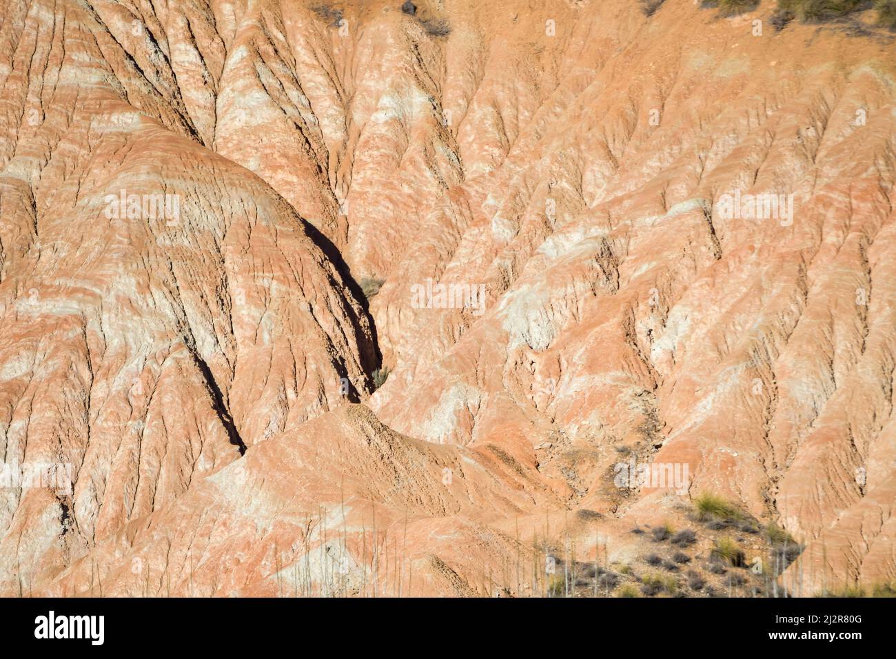 Badland, red lands without vegetation of the Granada Geopark. Stock Photo