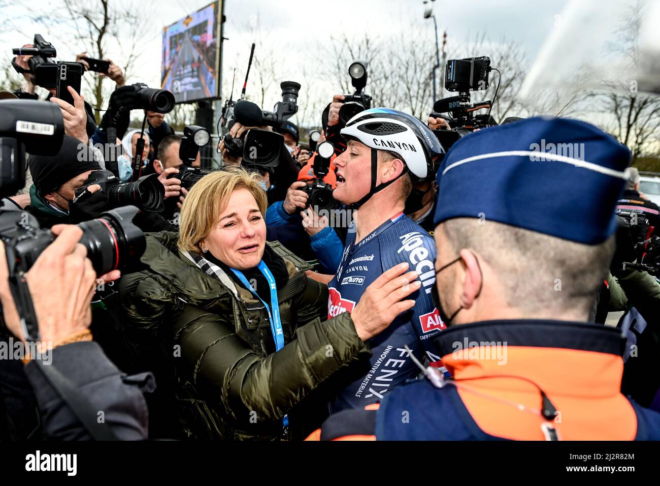 Belgium. 3rd April 2022, Belgium. The 2022 Tour of Flanders from Antwerp (Antwerpen) to Oudenaarde. Mathieu Van Der Poel for team AlpecinFenix (NED) embraces his mother on the finish line after winning the stage. Credit: Peter Goding/Alamy Live News Stock Photo