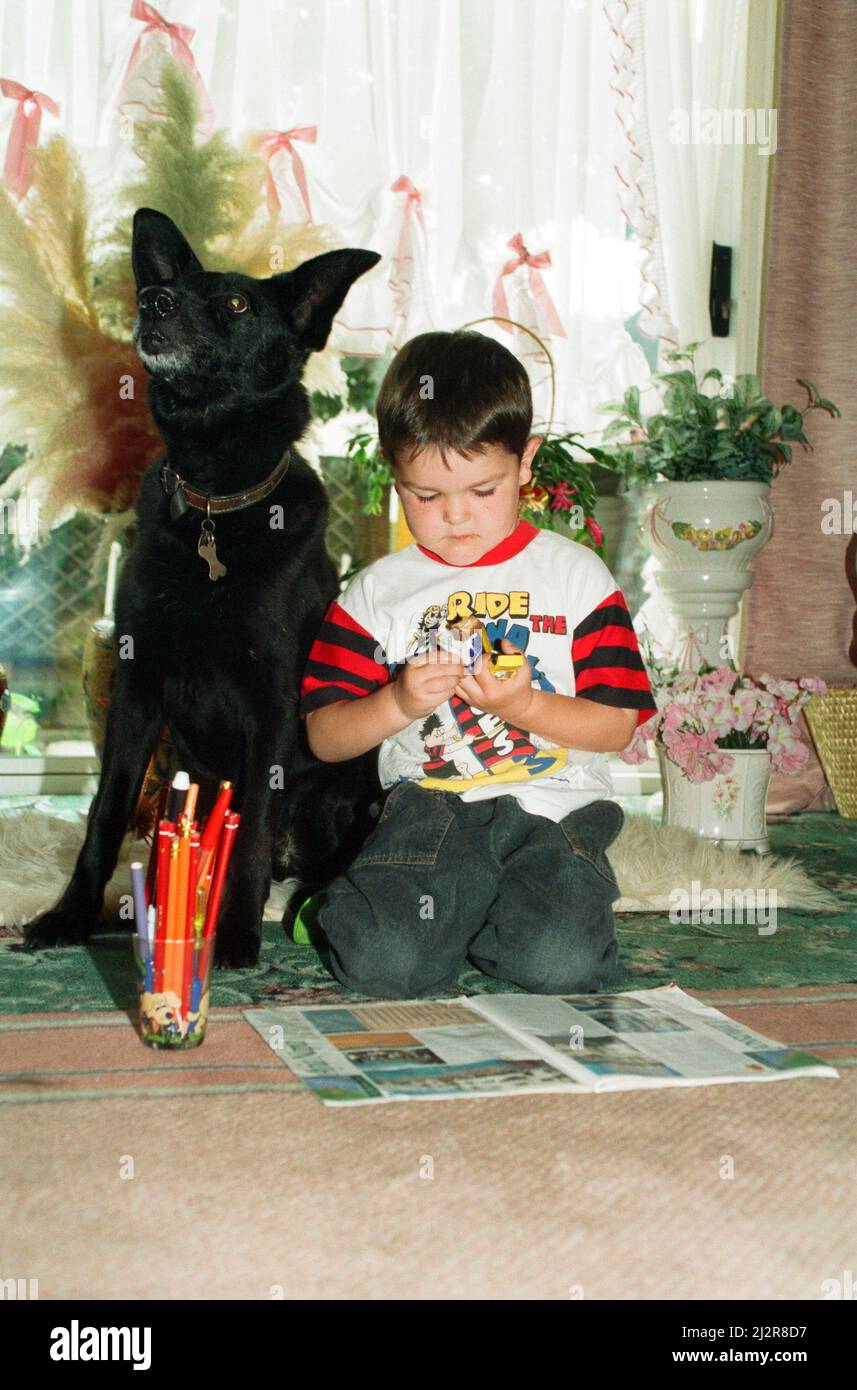 Blackie the dog is pictured with a small boy. 17th June 1993. Stock Photo