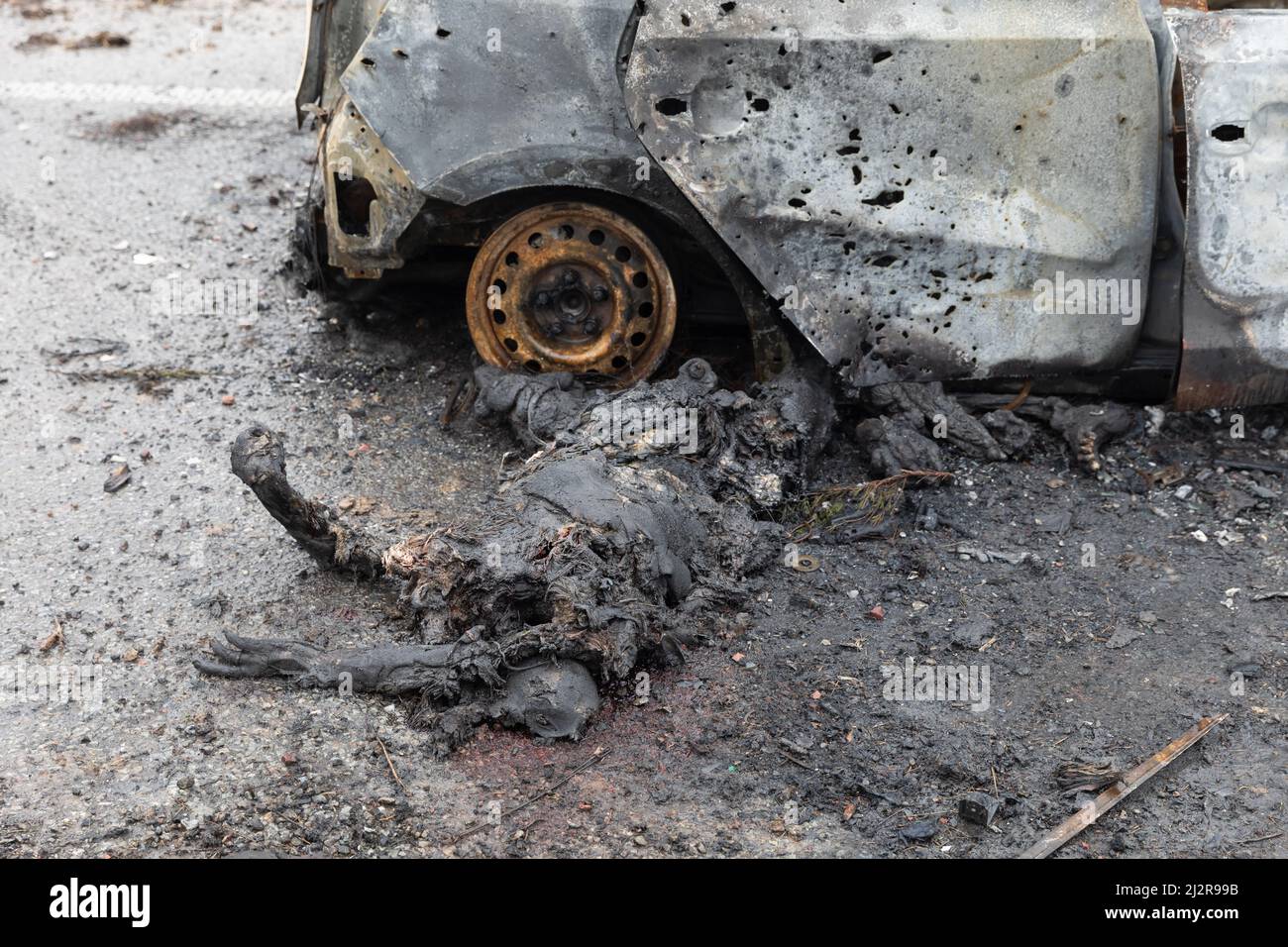 Kyiv, Ukraine. 02nd Apr, 2022. (EDITORS NOTE: Image depicts death)Bodies of dead civilians and wrecked burnt cars as a result of shelling by Russian invaders seen on a Kyiv-Zhytomyr highway 20 km from Kyiv. (Photo by Mykhaylo Palinchak/SOPA Images/Sipa USA) Credit: Sipa USA/Alamy Live News Stock Photo