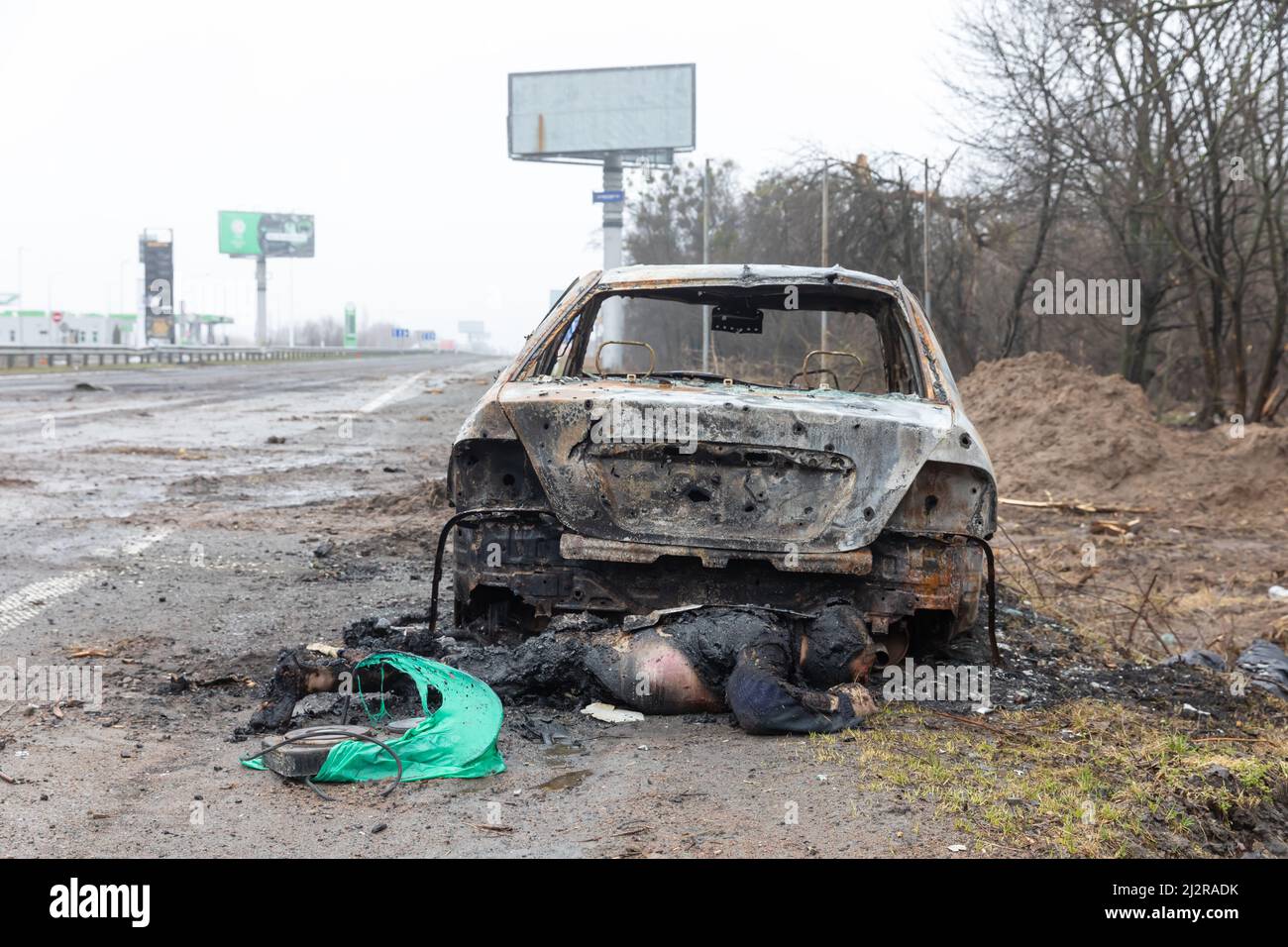 Kyiv, Ukraine. 02nd Apr, 2022. (EDITORS NOTE: Image depicts death)Bodies of dead civilians and wrecked burnt cars as a result of shelling by Russian invaders seen on a Kyiv-Zhytomyr highway 20 km from Kyiv. (Photo by Mykhaylo Palinchak/SOPA Images/Sipa USA) Credit: Sipa USA/Alamy Live News Stock Photo