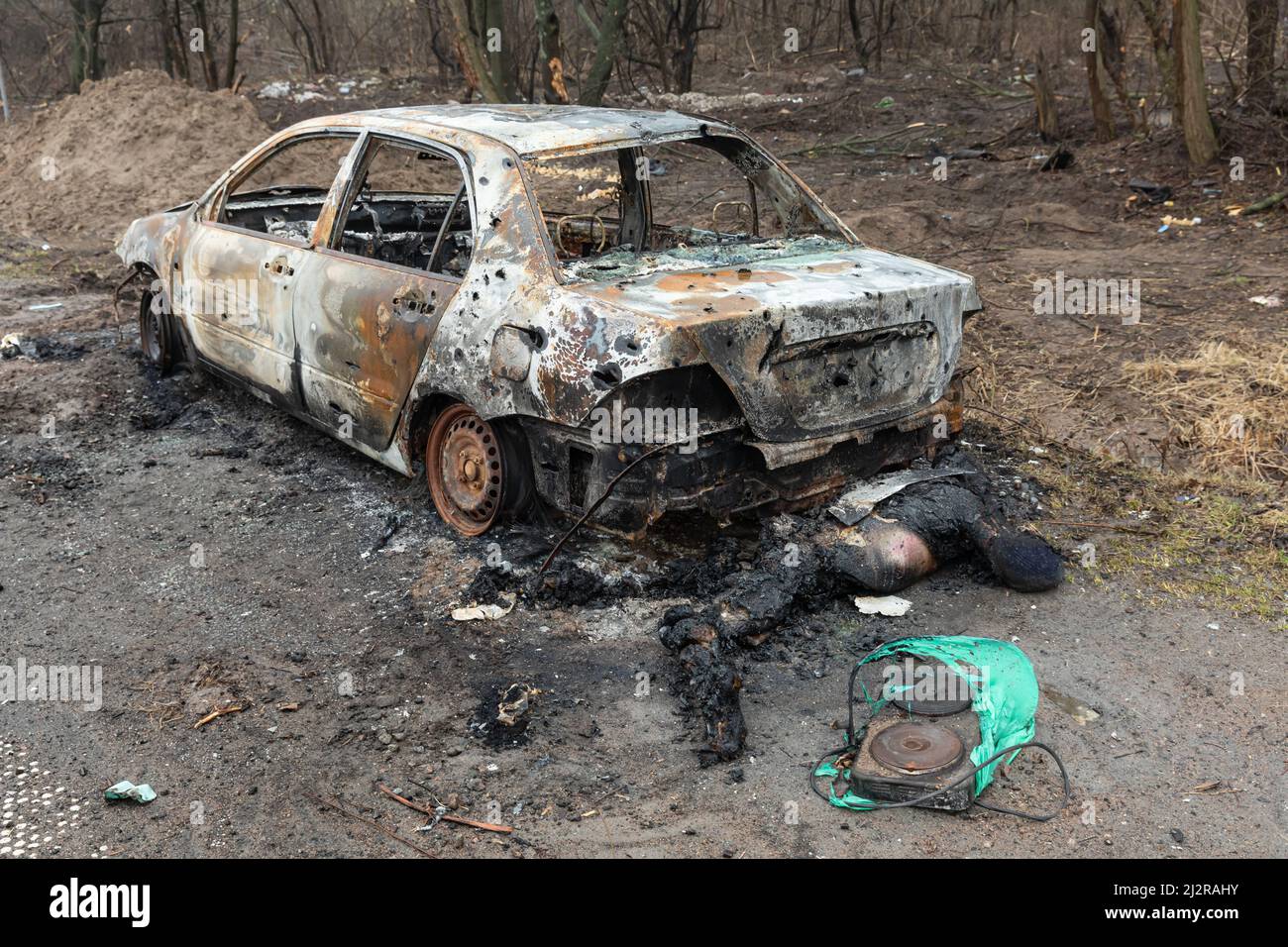 Kyiv, Ukraine. 02nd Apr, 2022. (EDITORS NOTE: Image depicts death)Bodies of dead civilians and wrecked burnt cars as a result of shelling by Russian invaders seen on a Kyiv-Zhytomyr highway 20 km from Kyiv. (Photo by Mykhaylo Palinchak/SOPA Images/Sipa USA) Credit: Sipa USA/Alamy Live News Stock Photo