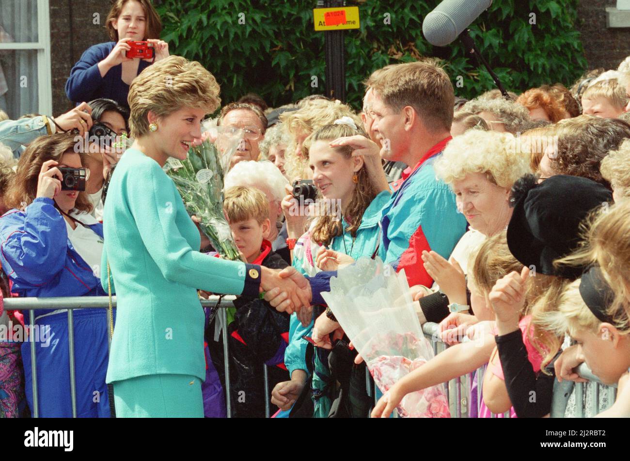 HRH The Princess of Wales, Princess Diana, meets to locals of Bury St Edmunds, Suffolk, on a walkabout after she'd spent time visiting patients at St Nicholas hospice.Whilst at the hospice she spoke with patient Josephine Brown (68) and explained how she would not pressure her sons William and Harry into doing royal duties too young.  Picture taken 27th July 1993 Stock Photo