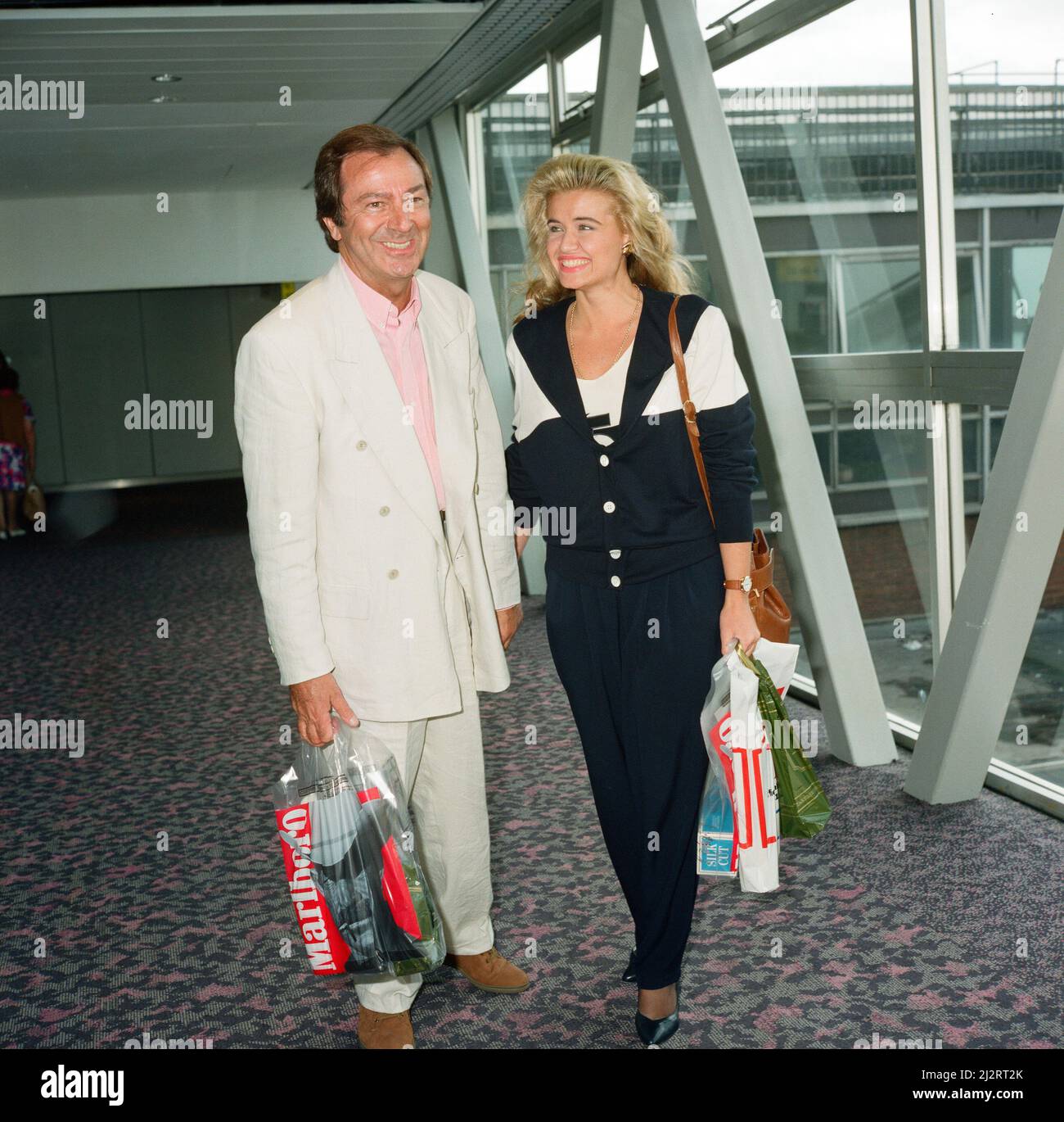 Des O'Connor and girlfriend Jodie Brooke Wilson and Heathrow Airport ...