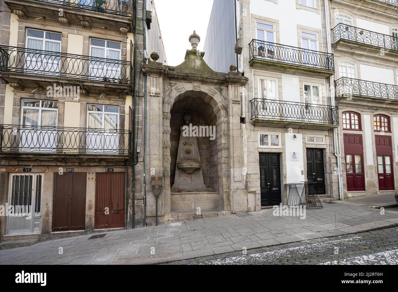 Porto, Portugal. March 2022.   view of an ancient fountain on Taipas street in the city center Stock Photo