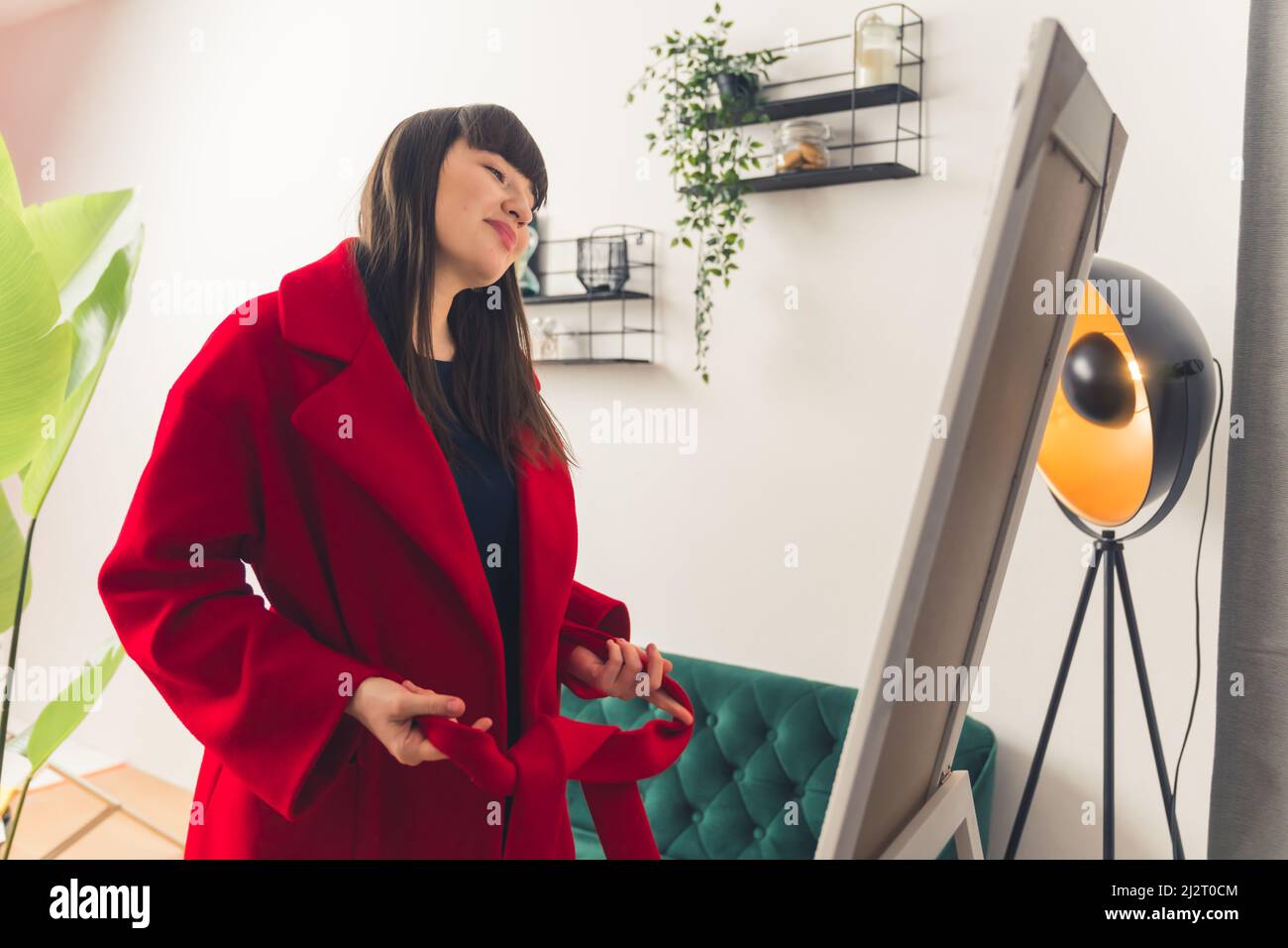 Excited young Caucasian woman enjoys new clothes after online shopping concept portrait copy space . High quality photo Stock Photo