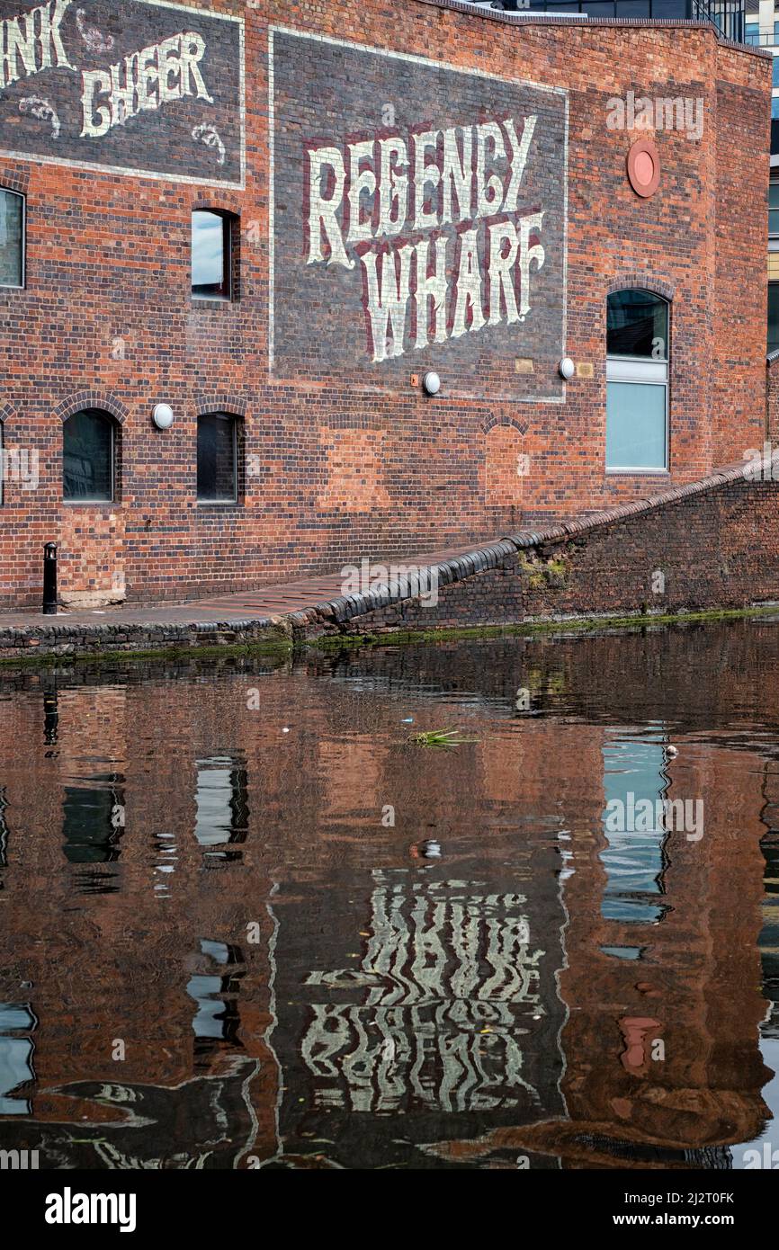 BIRMINGHAM, UK - MAY 28, 2019:  Sign for the Victorian Regency Wharf with reflection in canal Stock Photo