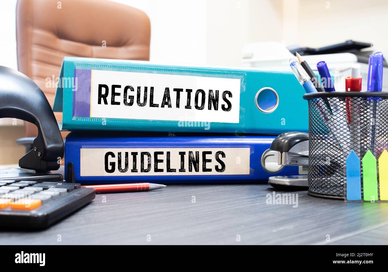 Folders with the label Regulations and Guidelines Stock Photo - Alamy