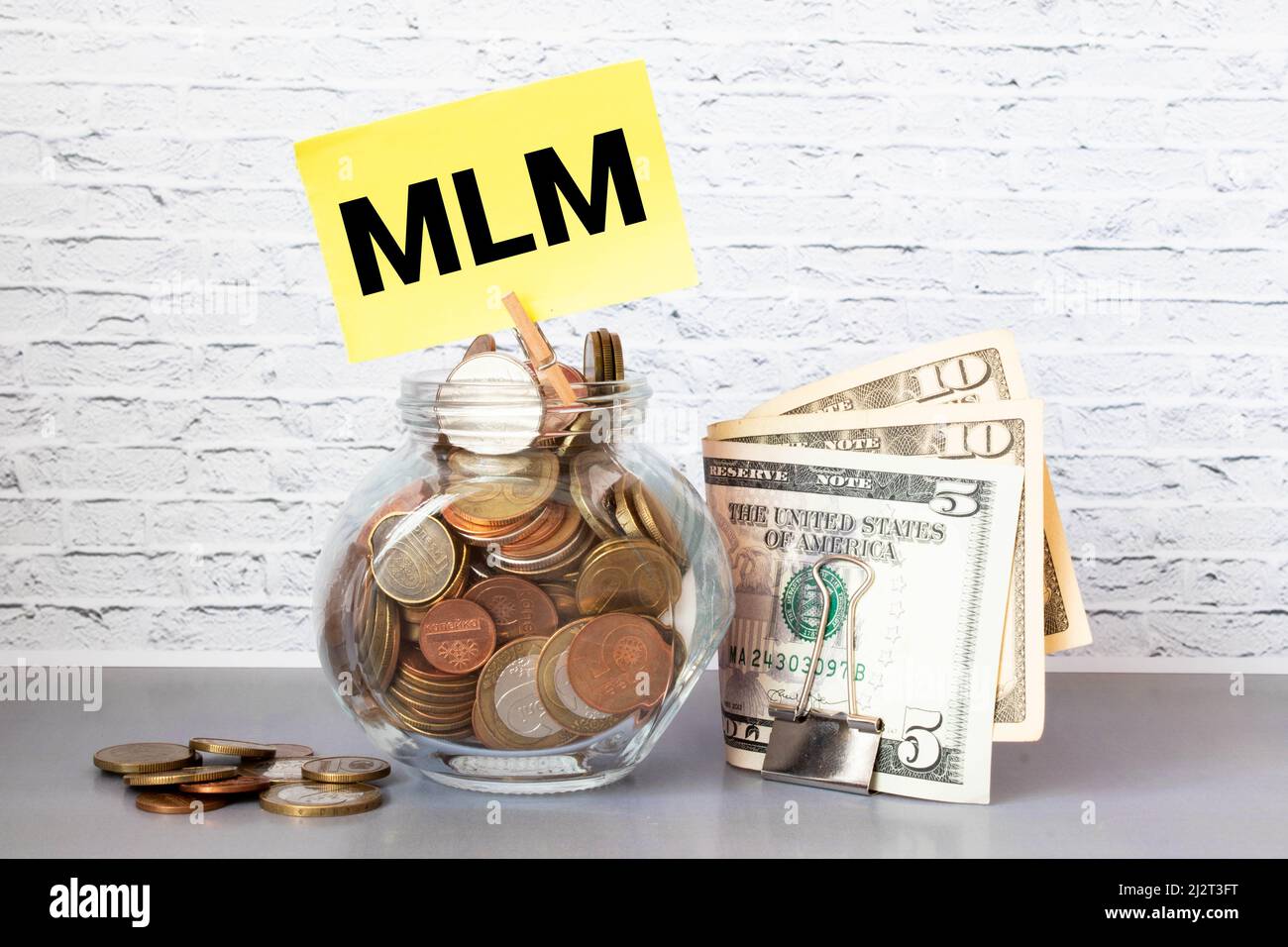 Top view of money with MLM or Multi Level Marketing wording. Business concept Stock Photo