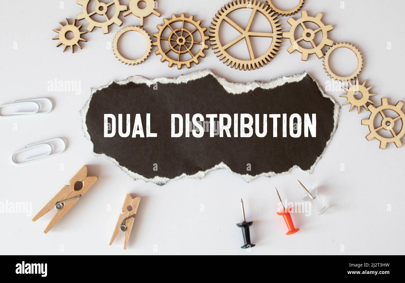 text Dual Distribution on white paper, business concept Stock Photo - Alamy