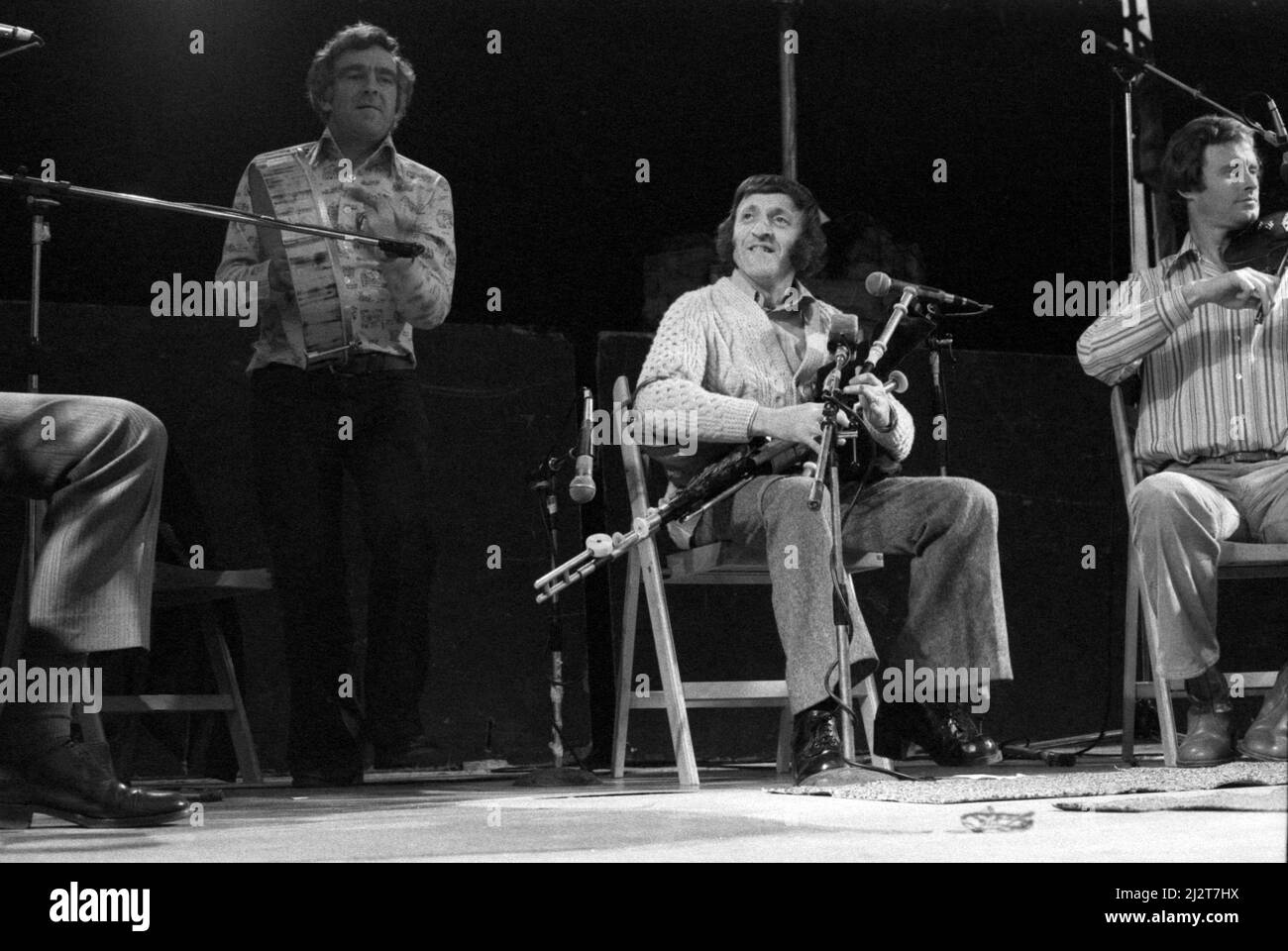 Seán Potts (left) and Paddy Moloney performing with The Chieftains at the July Wakes folk festival in Chorley, Lancashire, England on 25 July 1976. Stock Photo