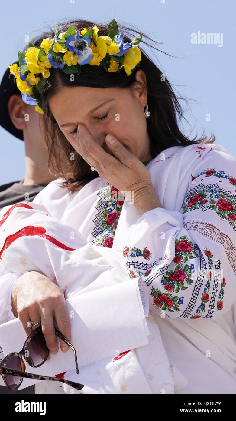 St. Louis, United States. 03rd Apr, 2022. Irina Podgorny wipes away tears after delivering a speech in Russian, on the steps of the Gateway Arch in St. Louis on Sunday, April 3, 2022. The Ukrainian community gathered at the Arch, with donated stuffed animals, representing the hundreds of children that have been killed during the current Russian invasion. The gathering included words of encouragement, prayers and Ukrainian music. Photo by Bill Greenblatt/UPI Credit: UPI/Alamy Live News Stock Photo