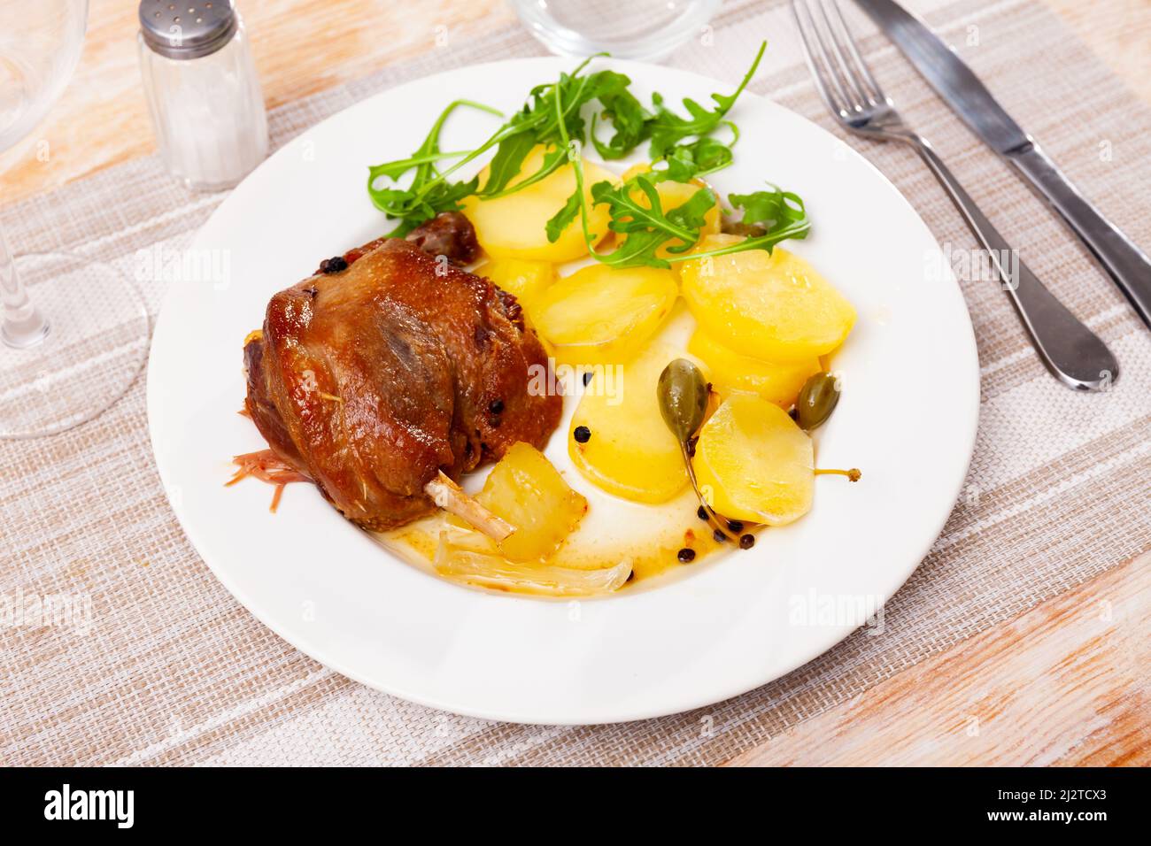 Fried duck confit with roasted potatoes Stock Photo Alamy