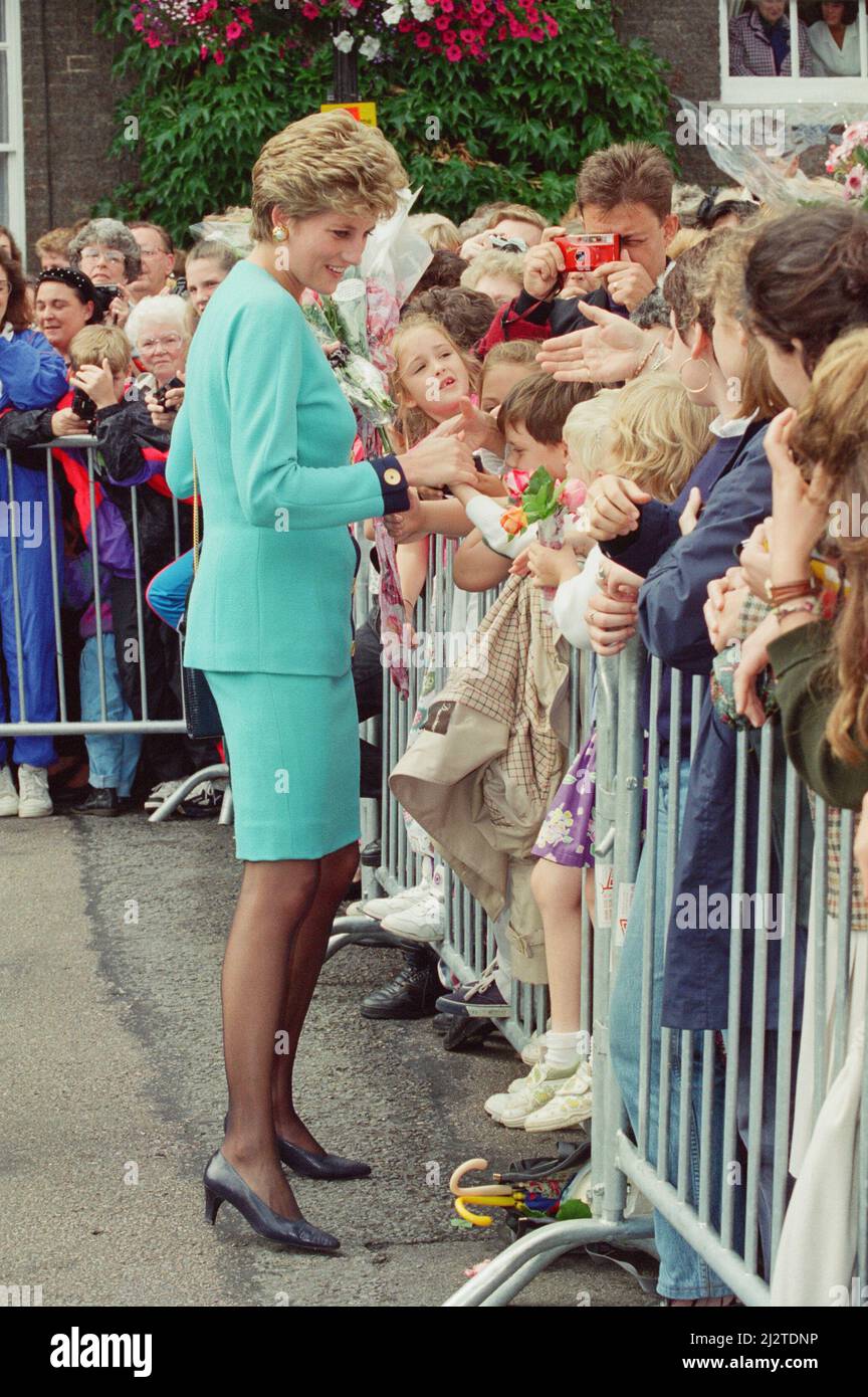 HRH The Princess of Wales, Princess Diana, meets to locals of Bury St Edmunds, Suffolk, on a walkabout after she'd spent time visiting patients at St Nicholas hospice.Whilst at the hospice she spoke with patient Josephine Brown (68) and explained how she would not pressure her sons William and Harry into doing royal duties too young.  Picture taken 27th July 1993 Stock Photo