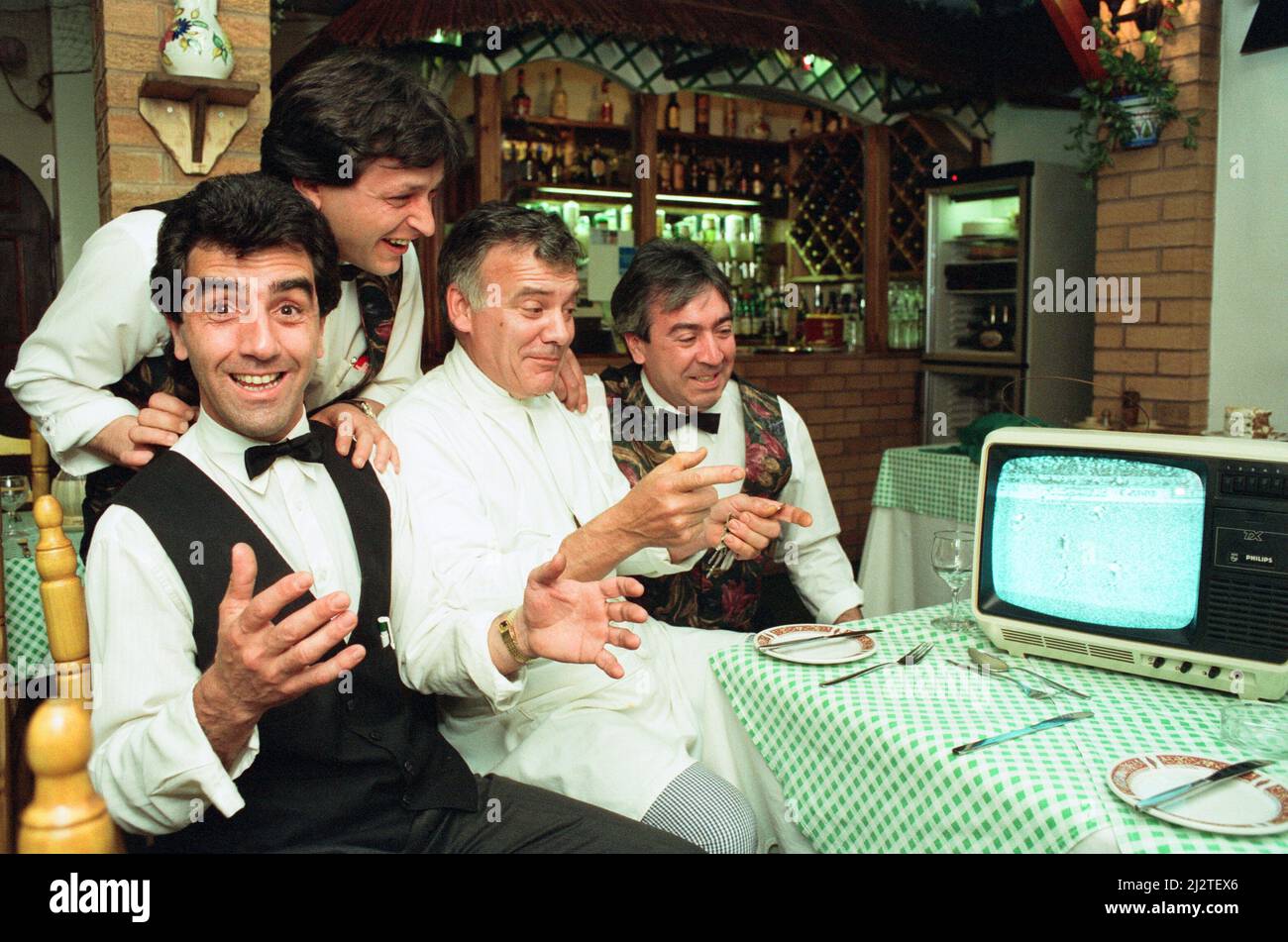 Spanish staff from Casa Paco and Latino restaurants in Flecthers Walk, Birmingham, watching the European Cup on a small portable TV in the restaurant with a loop aerial giving a very poor quality picture but at least they can support their team. L to R Pepe Lopez, Paco Diaz, Pedro Altobelli, Rafael Martinez and Jose Gil. 20th May 1992. Stock Photo