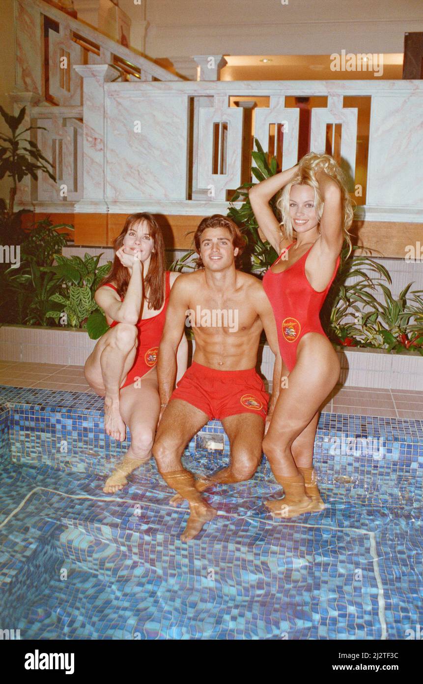 Baywatch stars in a photocall, in London, forthe TV series now appearing on British Television.  Picture shows Pamela Anderson (blonde) Alexandra Paul (brunette) and David Charvet  Picture by Arnold Slater  Picture taken 21st January 1993 Stock Photo