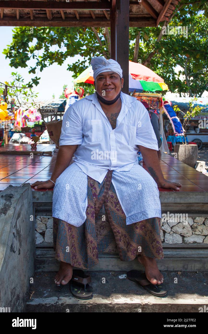 Balinese man in Goa Lawah, Bali, Indonesia dressed for a ceremony at the Bat Cave temple. Stock Photo