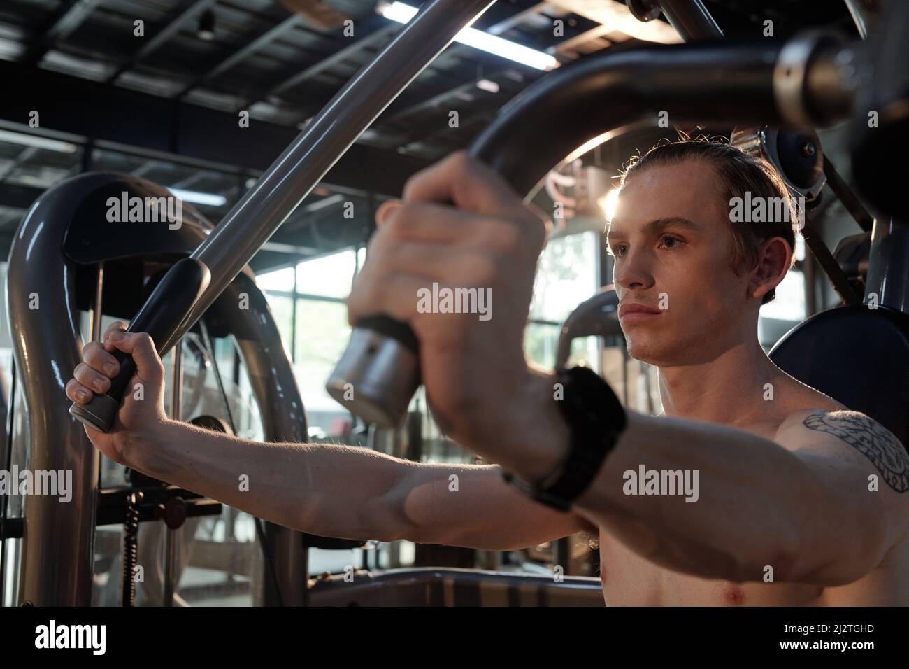 Pensive serious fit man working out in gym in the morning before work Stock Photo Alamy