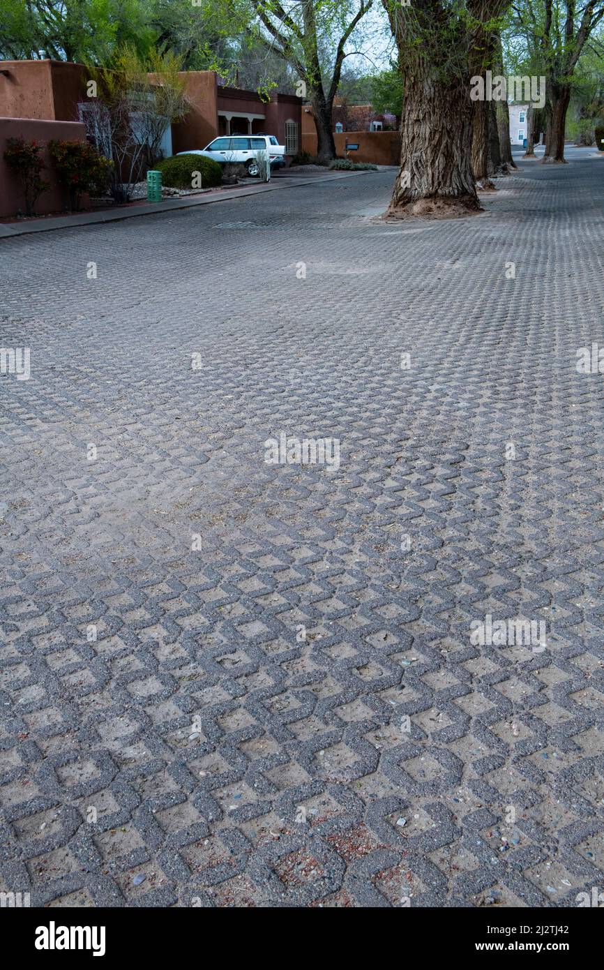Permeable pavement on a residential city street allows stormwater runoff to filter through surface voids. Stock Photo
