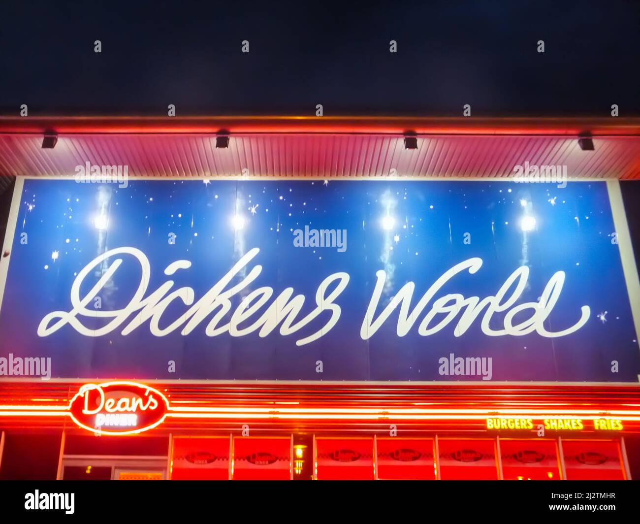 The neon lit storefront of Dean's Diner at Dickens World in Chatham, North Kent UK. Stock Photo