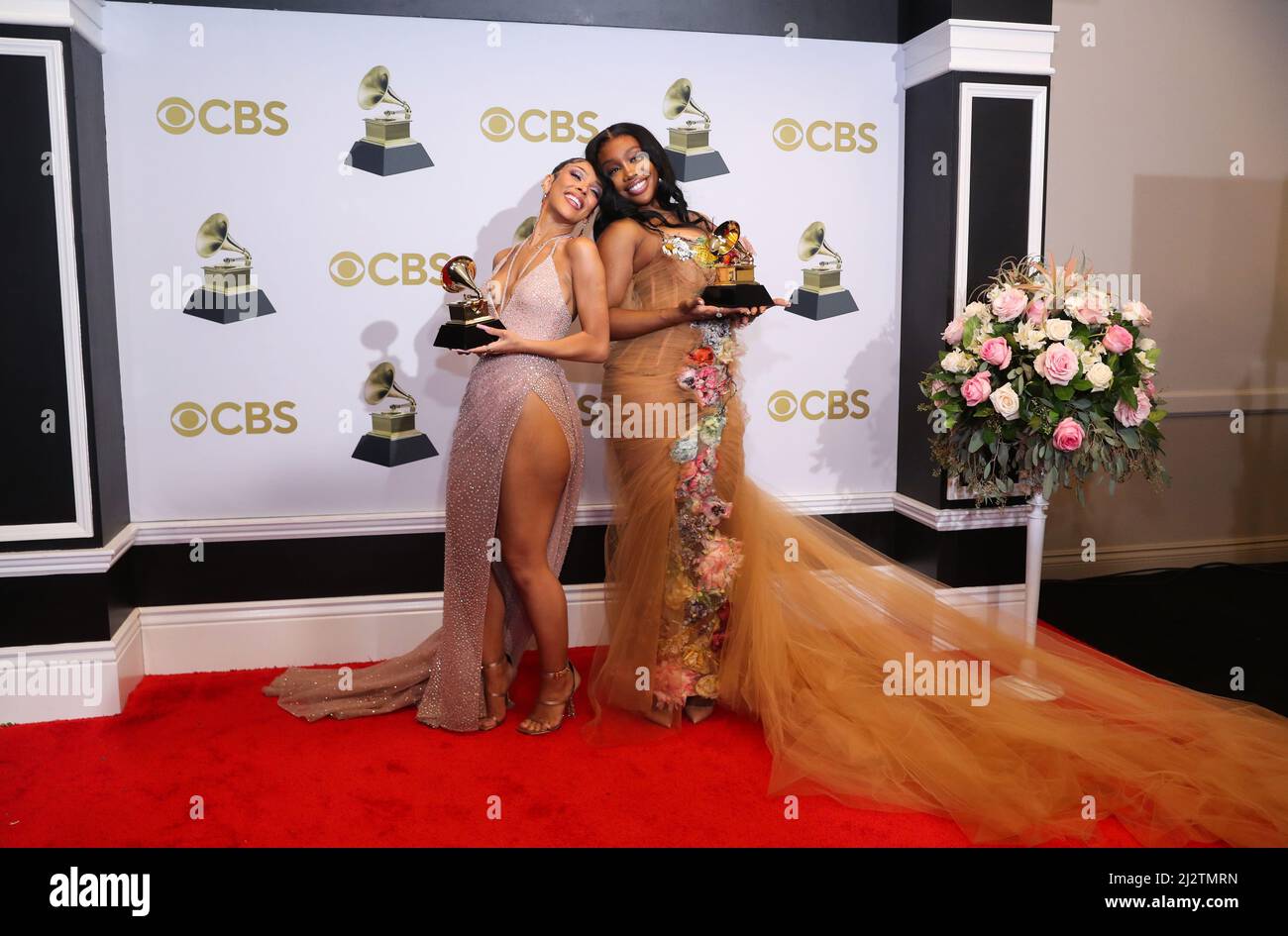 Doja Cat and SZA pose with their Grammys for Best Pop Duo Group