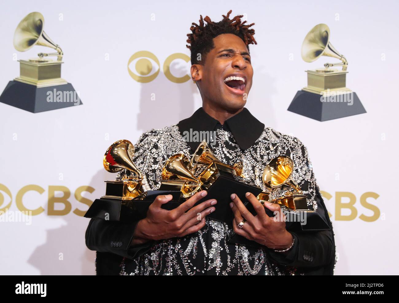 Jon Batiste poses with their Grammys for Best American Roots Performance for 'Cry,' Album of the year for “We Are,” Best American roots song,  Best music video and Best score soundtrack for visual media for “Soul,' at the 64th Annual Grammy Awards at the MGM Grand Garden Arena in Las Vegas, Nevada, U.S., April 3, 2022. REUTERS/Steve Marcus Stock Photo