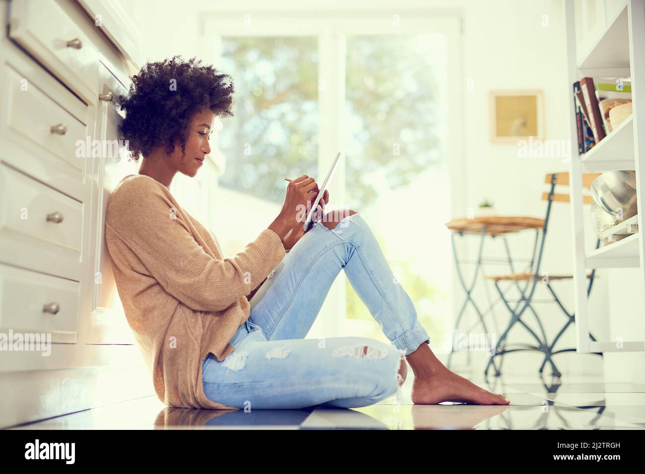 African woman sitting alone side view hi-res stock photography and ...