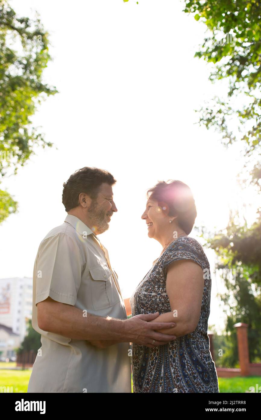 Two Spouses Happy mature couple. Date and walk, portrait of two spouses. Front view ...