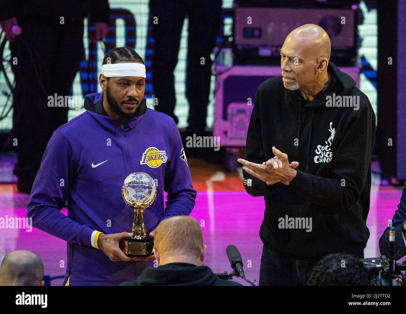 April 3, 2022, LOS ANGELES, CALIFORNIA, USA: Retired basketball player  Kareem Abdul-Jabbar presents the Trophy for the leagueâ€™s annual Social  Justice Champion award to Carmelo Anthony #7 of the Los Angeles Lakers