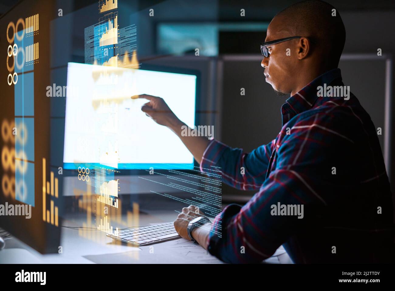 Hes getting deep into the code. Cropped shot of a young male programmer working on computer code in his office. Stock Photo