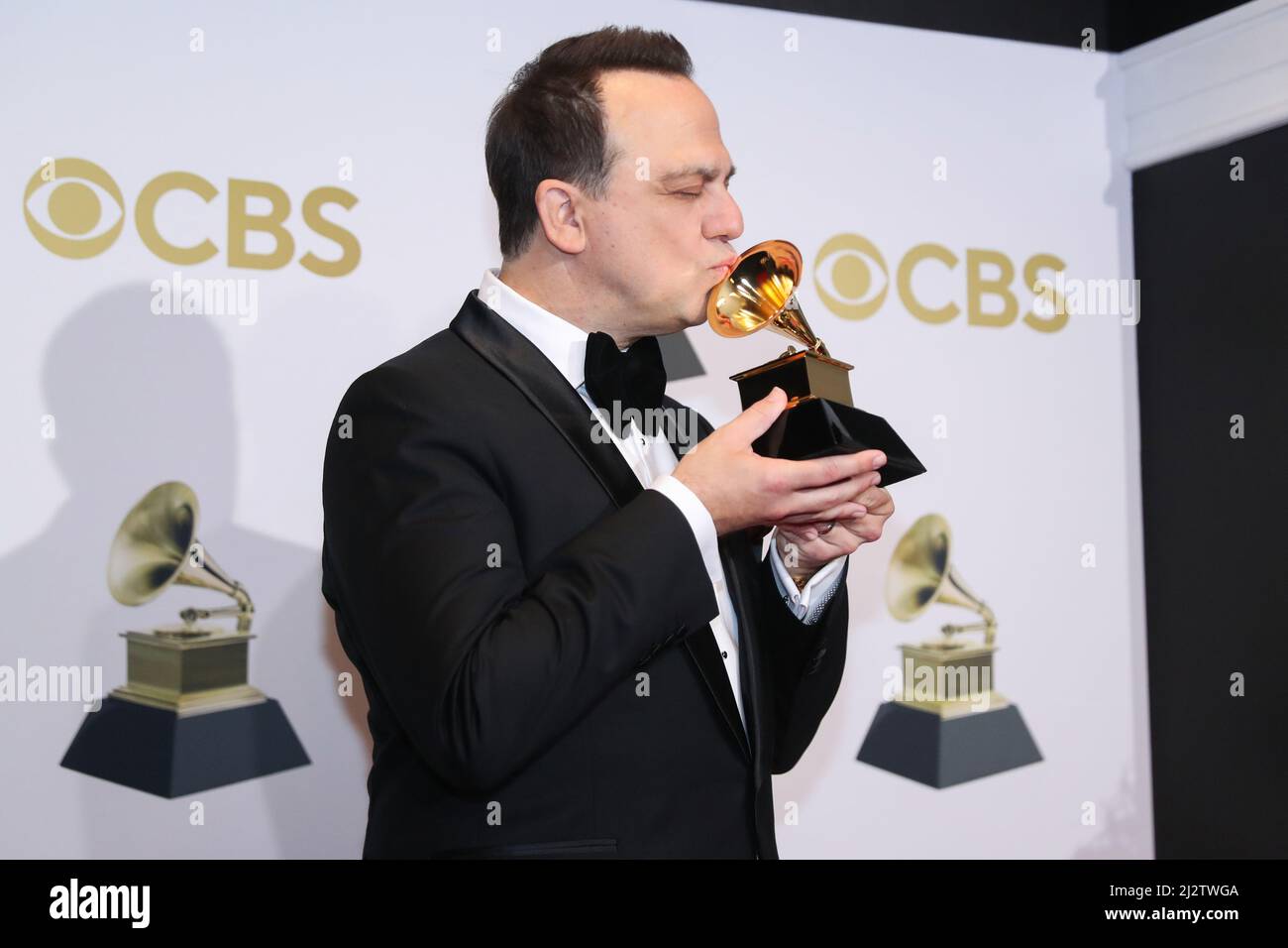 Carlos Rafael Rivera poses with their Grammys for winner of the Best Score Soundtrack for Visual Media award for 'The Queen's Gambit,' at the 64th Annual Grammy Awards at the MGM Grand Garden Arena in Las Vegas, Nevada, U.S., April 3, 2022. REUTERS/Steve Marcus Stock Photo