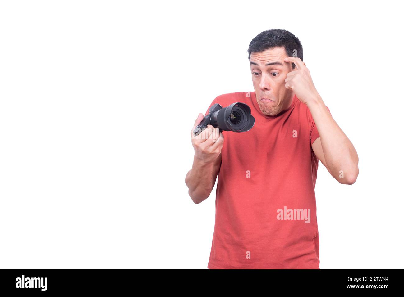 Puzzled man looking at photo camera with confuse Stock Photo
