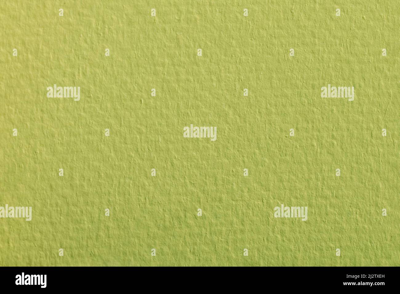 Macro texture of green paper surface. Watercolor sheet herbal green