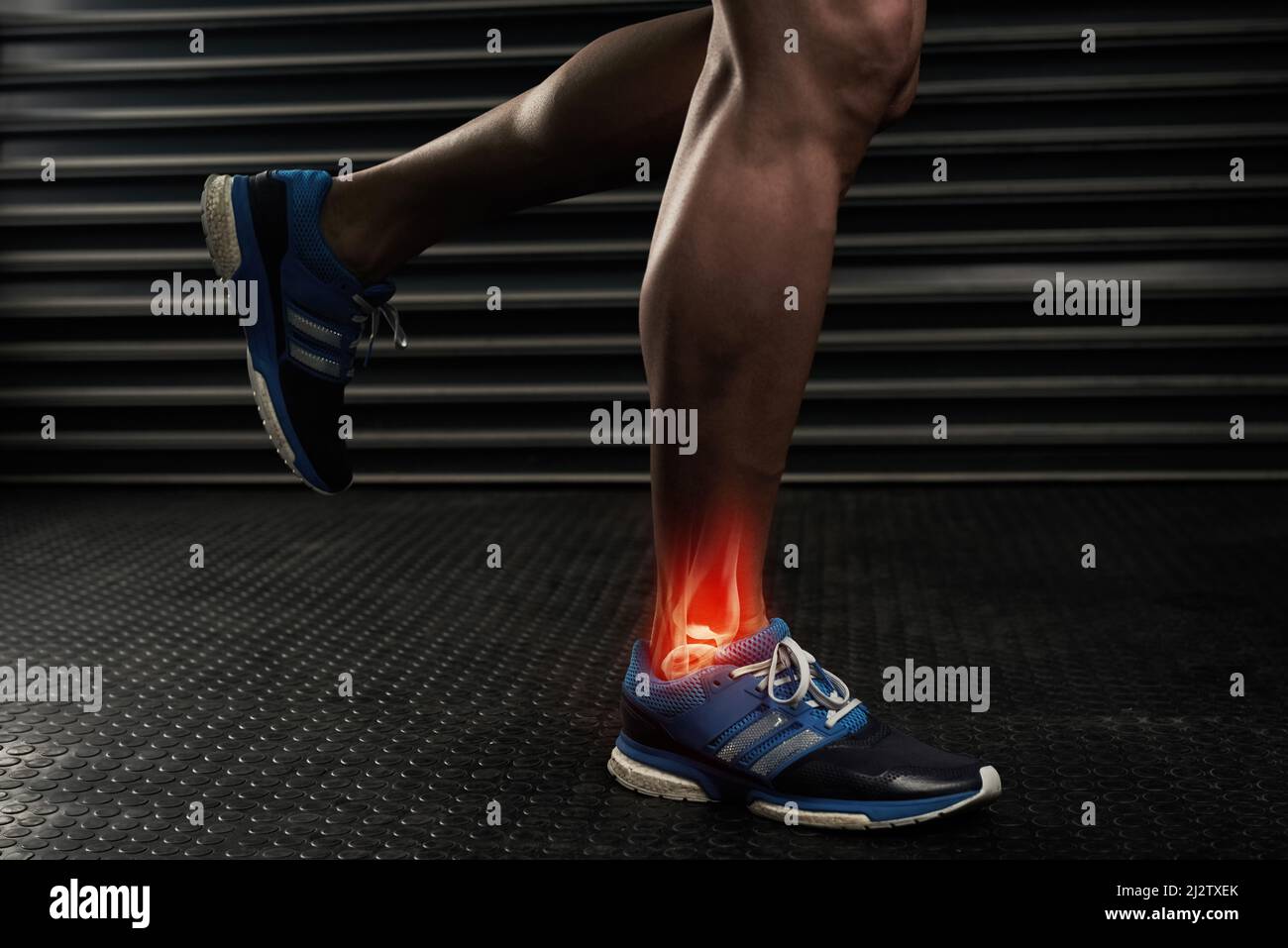 Rehabilitating his ankle. Studio shot of an unrecognizable man working out with an ankle injury. Stock Photo